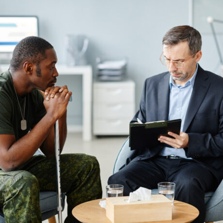 Therapist and patient engaged in conversation.